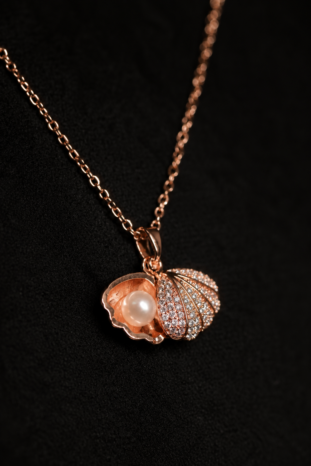 A delicate necklace with a pearl shell pendant